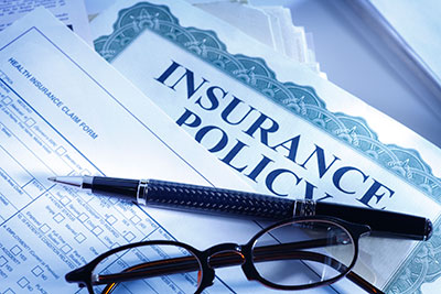 image of insurance documents ready to review by Guardian Insurance